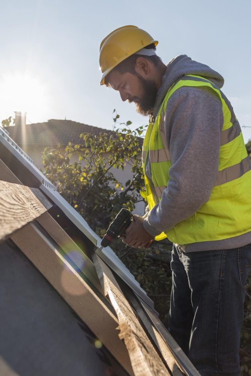 man-working-roof-with-drill